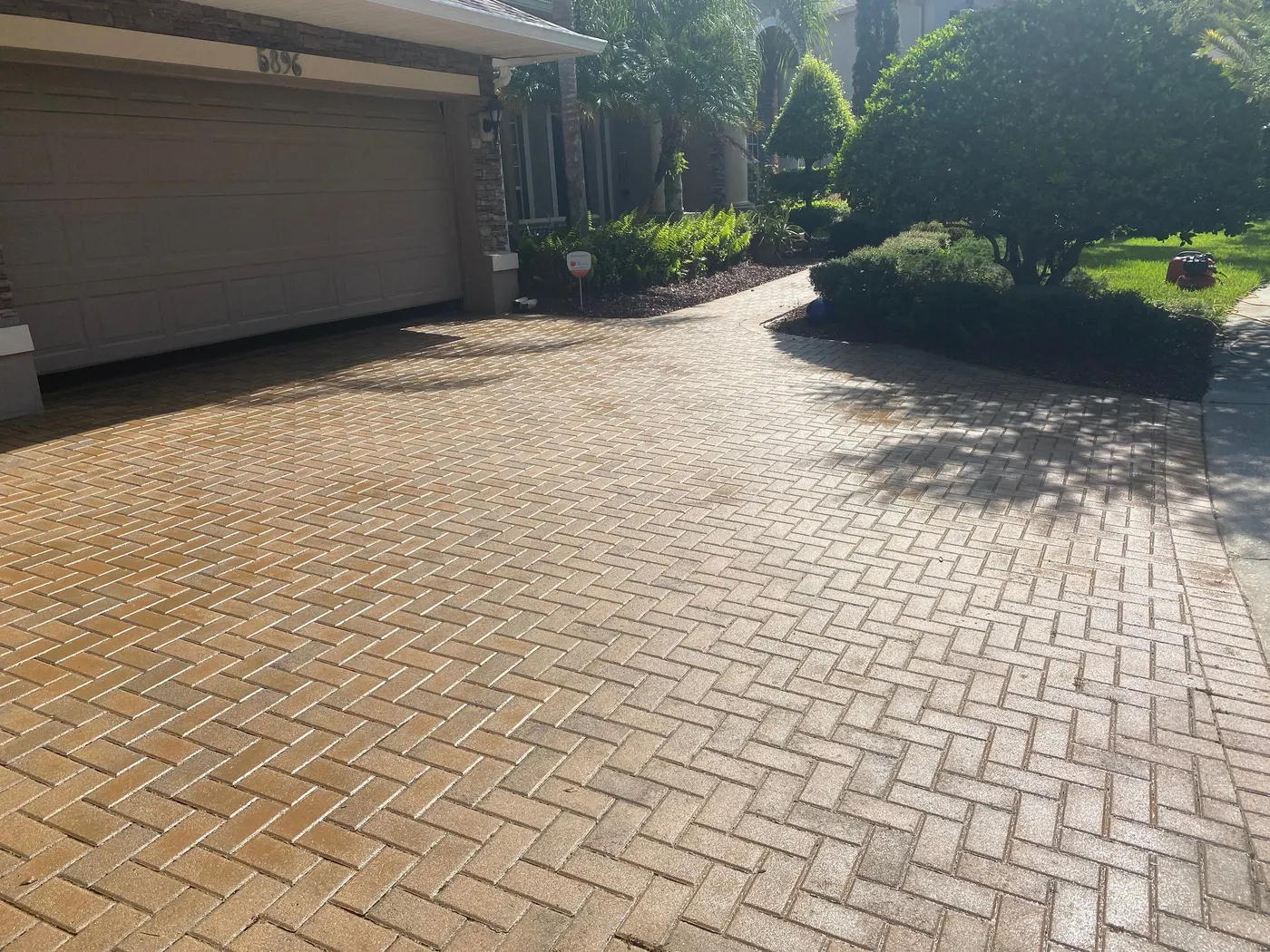 Paver driveway restored with SignaSeal, color brought back to life